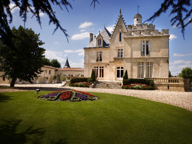 Historic château entrance with stone architecture at Pessac-Léognan Grand Cru