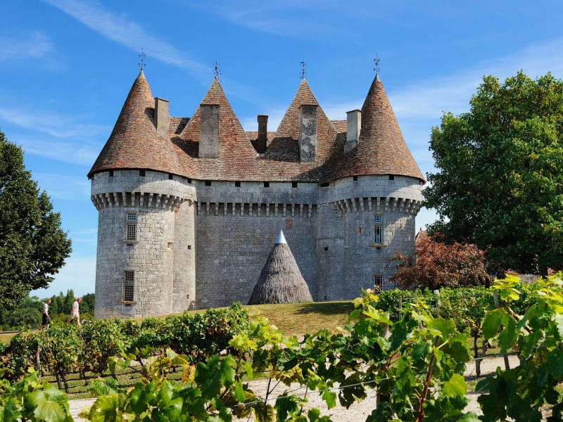 Château Monbazillac surrounded by vineyards in the Bergerac wine region near Sarlat
