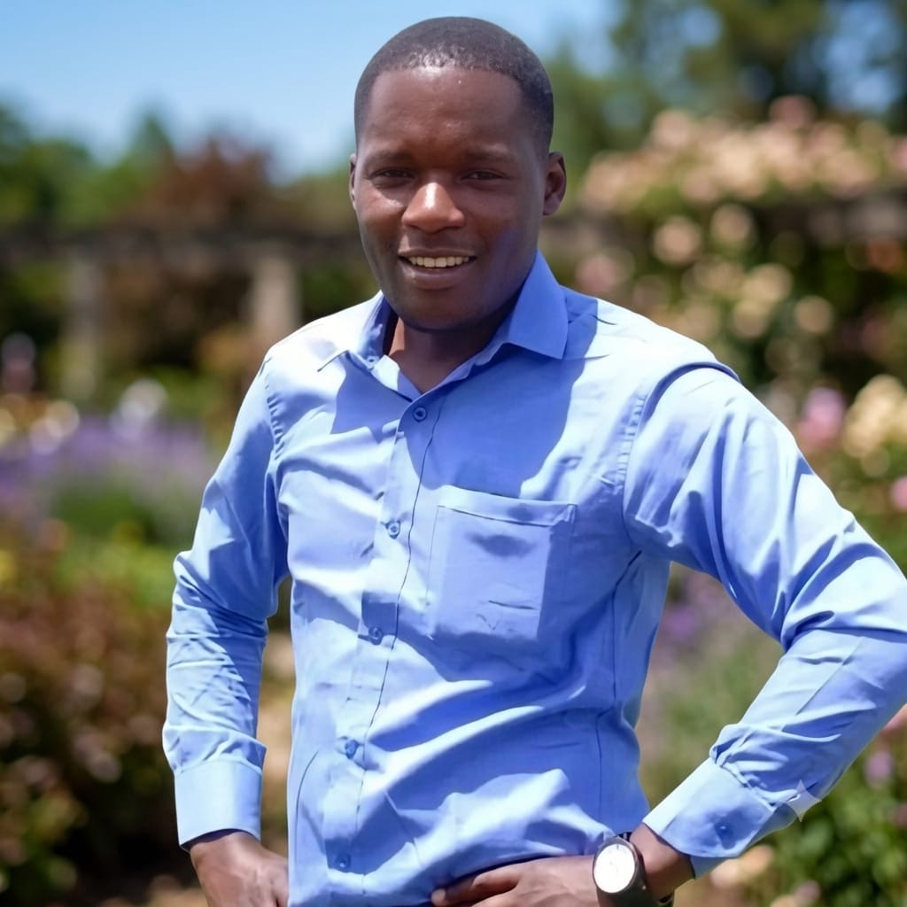 Saul Nyongesa Mupalia, software developer, standing outdoors in a blue shirt