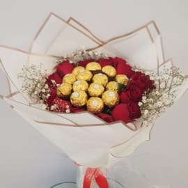 Red roses with Ferrero Topping and Bab's breath filling 