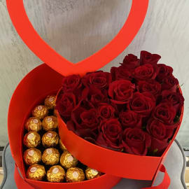 heart shape box of Red roses with Ferrero Rocher beneath it 