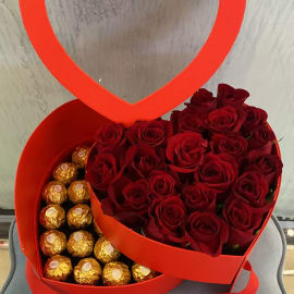 heart shape box of Red roses with Ferrero Rocher beneath it 