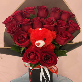 Red roses with Red teddy bear in an elegant black box. 