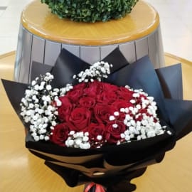 Vibrant red roses arranged in a beautiful bouquet.