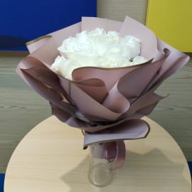 White roses bouquet, symbolizing purity and elegance.