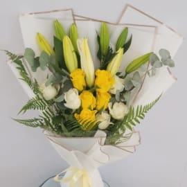 Sympathy flowers with white and yellow blooms