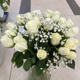 Sympathy flowers in a vase with delicate white roses