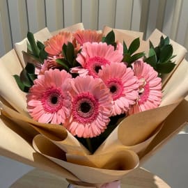 Vibrant Pink Gerbera Flower with Green Ruscus