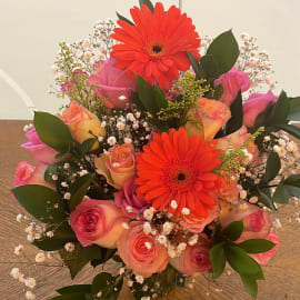 Green Ruscus and Baby's Breath Filling in Vase