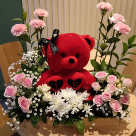 A charming arrangement of pink and white baby roses, symbolizing admiration and innocence, paired with a vibrant chrysanthemum for enduring affection.