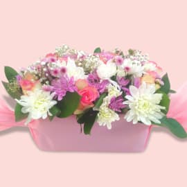 Beautiful flower bouquet featuring pink roses, white chrysanthemums, and baby’s breath.