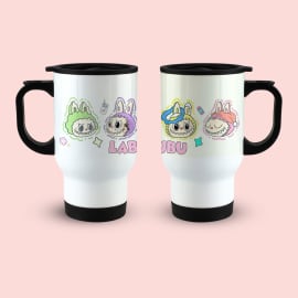 wo identical white travel mugs with black handles and lids, displayed side-by-side. The left mug shows a green and purple monster character with the word 