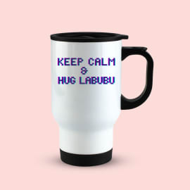 White travel mug with black handle and lid, displaying the text 