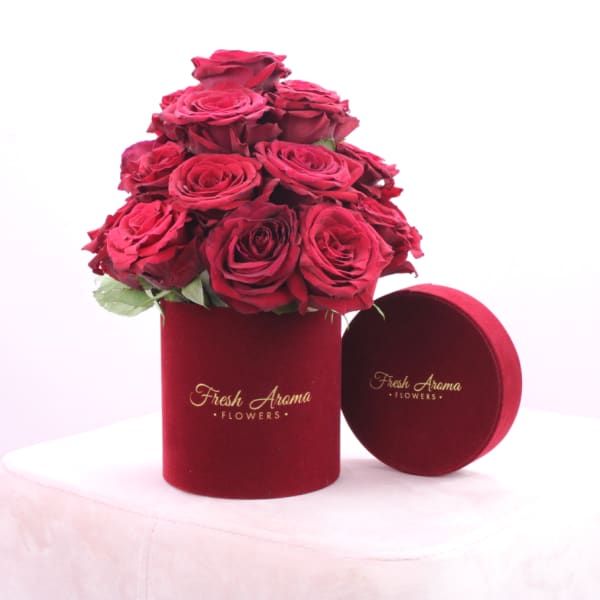 Red roses in red velvet box
