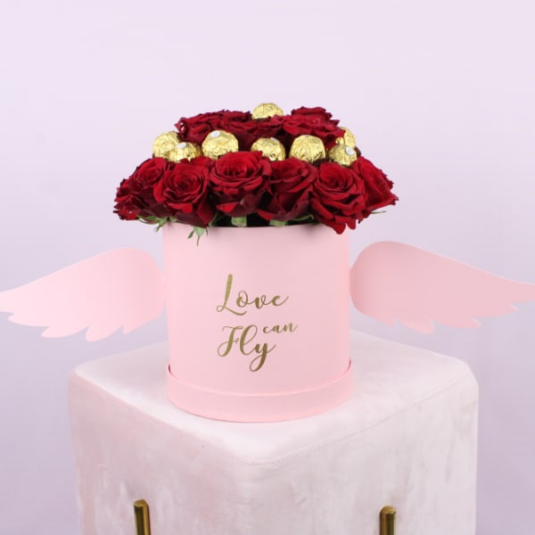 Red roses pink box with wings and Ferrero Rocher surrounding