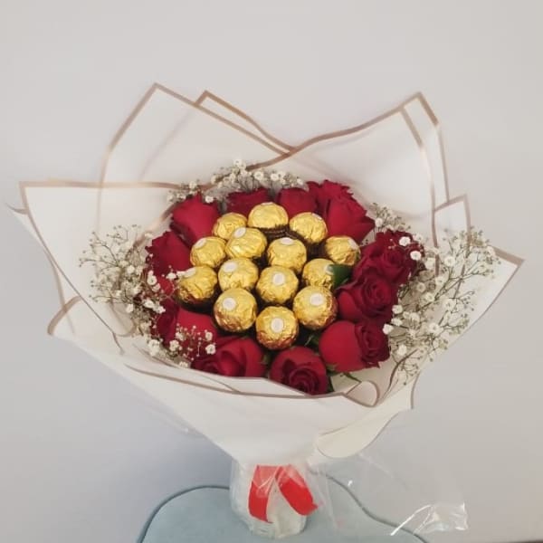 Red roses with Ferrero Topping and Bab's breath filling 