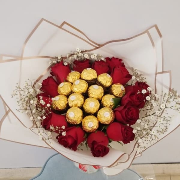 Red roses with Ferrero Topping and Bab's breath filling 