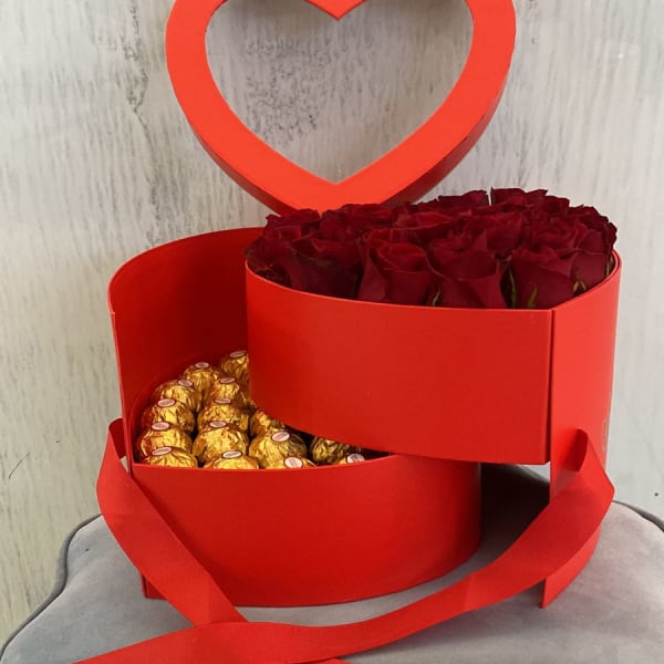 heart shape box of Red roses with Ferrero Rocher beneath it 