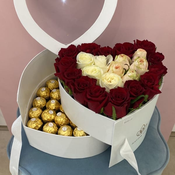 Arrangement of white and red roses with a Ferrero Rocher chocolates in a two-tier white Heart Box.