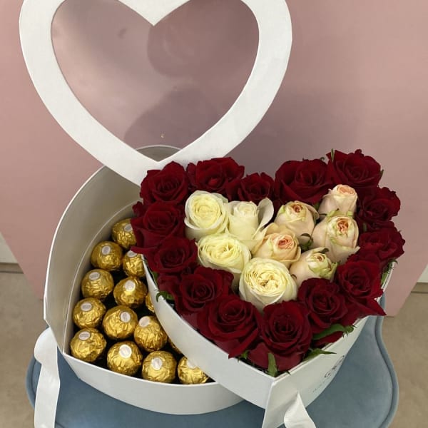 Arrangement of white and red roses with a Ferrero Rocher chocolates in a two-tier white Heart Box.