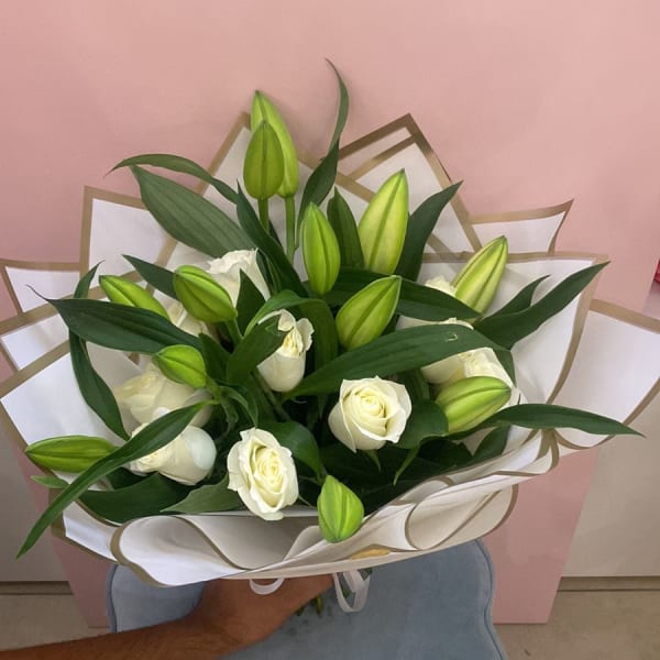 white lilies and whites roses in bouquet 