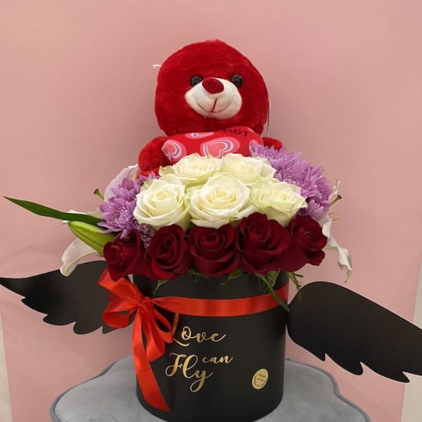 Black love can fly box loaded with white and red roses loaded with lilies , chrysanthemum and red teddy bear.