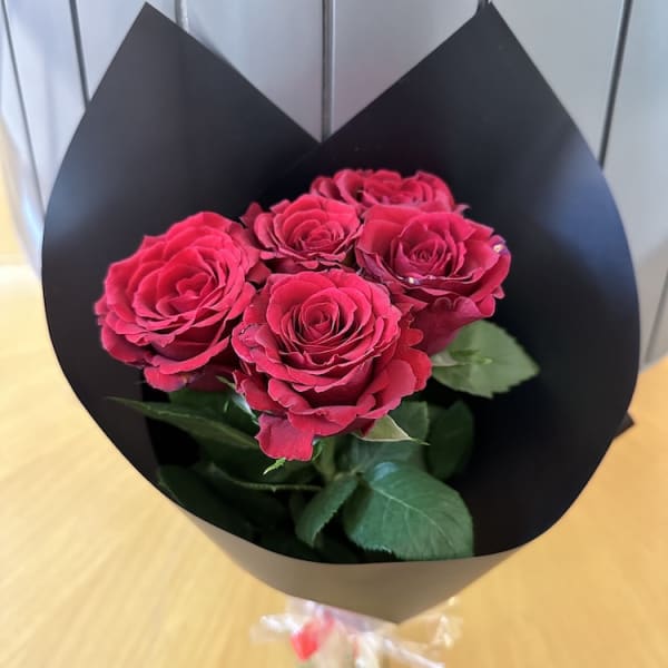 Close-up of the stunning 5 Red Roses in the Ruby Romance Bouquet, showcasing their rich hues and velvety petals