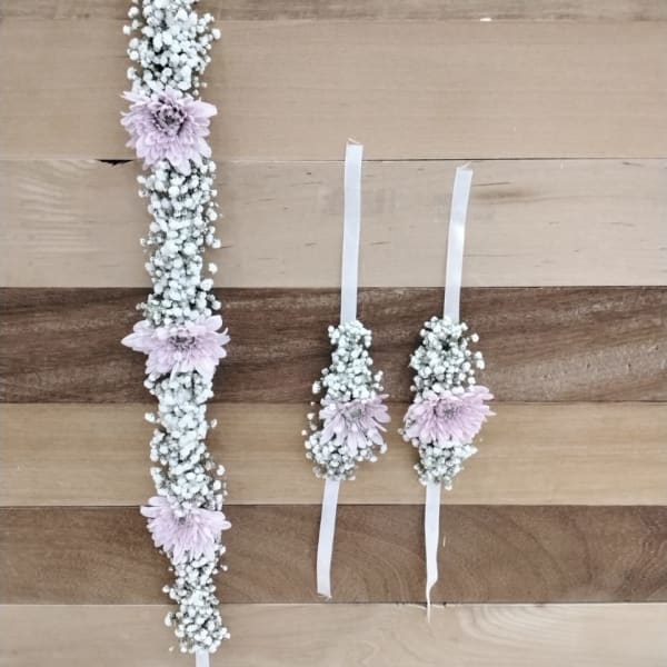 Elegant woman wearing floral bracelet and crown set, showcasing gajra-inspired Chrysanthemums and Gypsophila