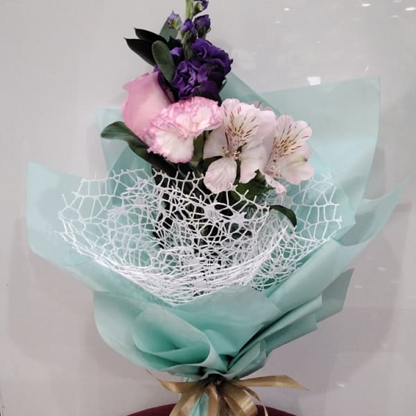 The delicate and enchanting Boquete flower arrangement adds a touch of elegance and grace to any space, with playful hues, intricate details, and sweet fragrance.