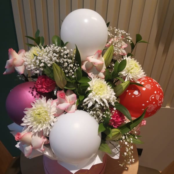 Beautiful birthday flower box with assorted flowers and balloons