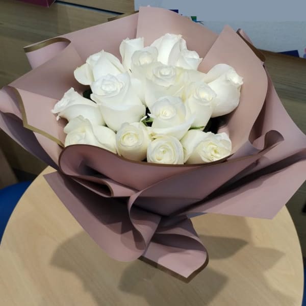 Captivating white roses, a timeless symbol of beauty.