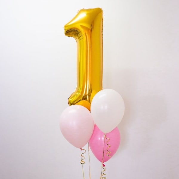 Number pink and white helium balloons for birthdays.