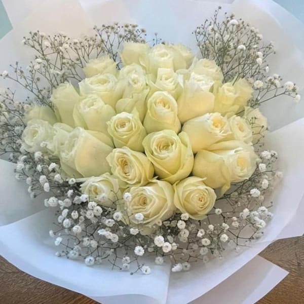 30 white roses with baby's breath