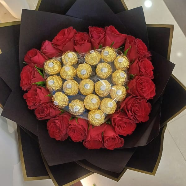  heart-shaped arrangement of 18 red roses and 19 Ferrero Rocher chocolates