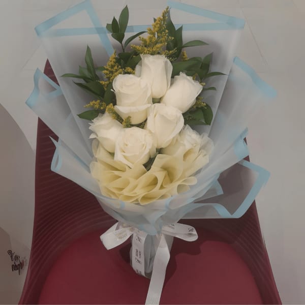 White Love's Promise Bouquet: Celebrate new beginnings with pristine white roses.