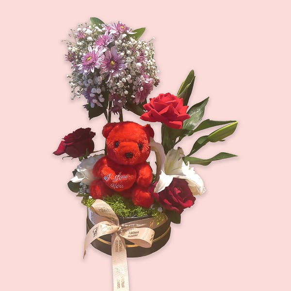 It contains 1 white Lilie , 1 purple chrysanthemum, 3 red roses, 2 white roses, 4 leaves ruscus, and 2 Gypsophila (Baby Breath)