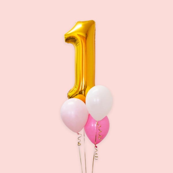 Number pink and white helium balloons for birthdays.