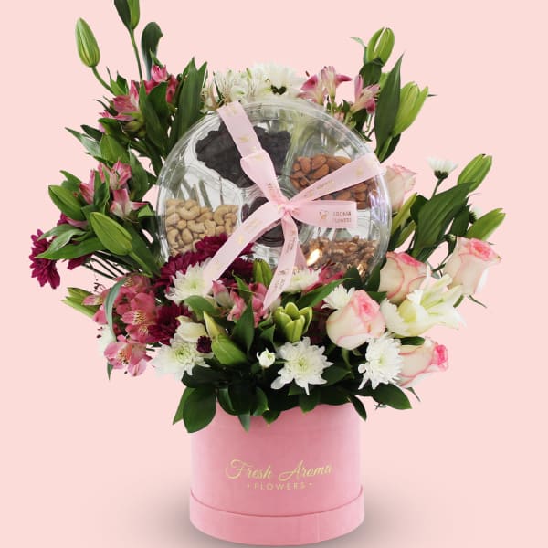 Elegant flower arrangement with a dry fruit gift box