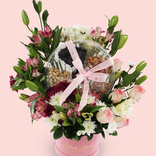 Elegant flower arrangement with a dry fruit gift box
