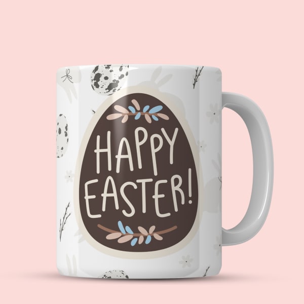 Pastel Easter mug with 'Happy Easter!' text and eggs.