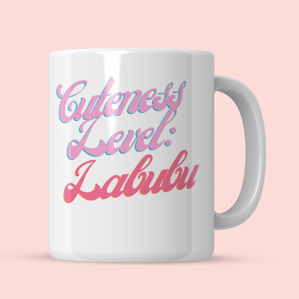 Text 'Cuteness Level: Labubu' on ceramic mug