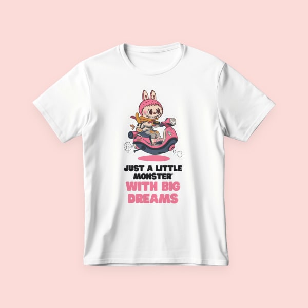 Labubu T-shirt featuring a cute pink scooter-riding monster and text “Just a little monster with big dreams.”