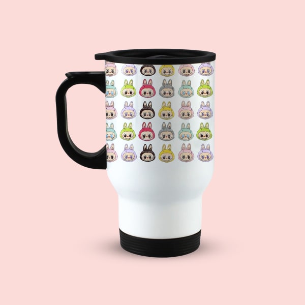 A single white travel mug with a black handle and lid, displaying a repeating pattern of colorful cartoon bunny faces, viewed from the front-left.