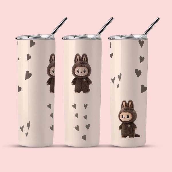 Three views of a light cream tumbler with a brown bunny character and floating brown hearts.