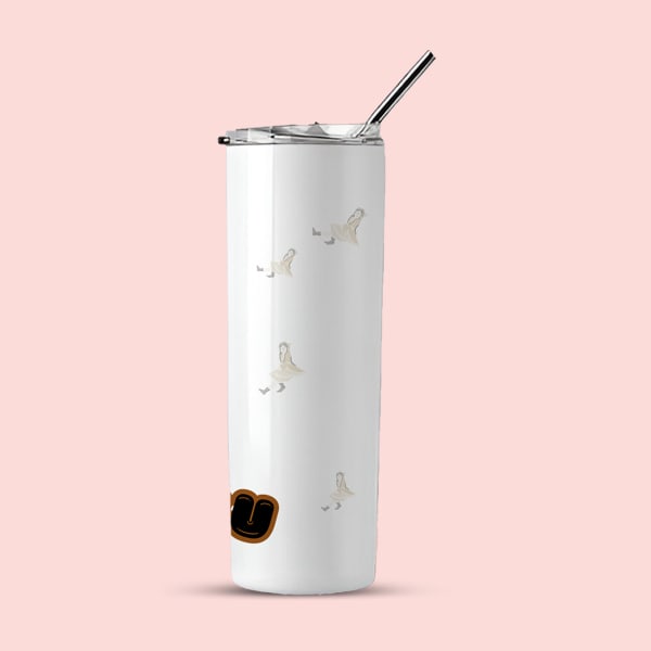  A white insulated tumbler with a black straw, featuring scattered subtle ghost-like figures and the beginning of the word 