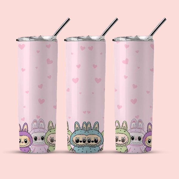 Three identical pink tumblers with small pink hearts and a group of monsters in bunny suits at the bottom, each shown with a lid and straw against a light pink background.