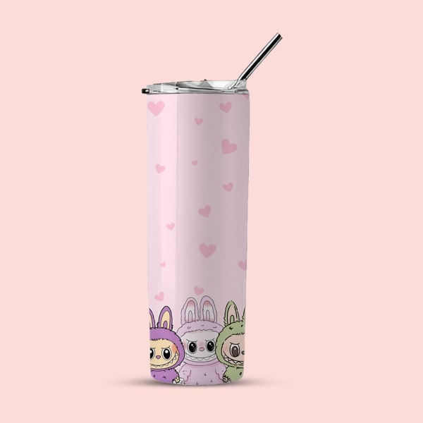 A pink tumbler with small pink hearts and three monsters (purple, pink, and green in bunny suits) at the bottom, shown with a lid and straw against a light pink background.