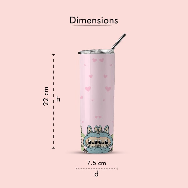 A pink tumbler with small pink hearts and a blue monster in a bunny suit at the bottom, shown with its dimensions: 22 cm height and 7.5 cm diameter, against a light pink background.