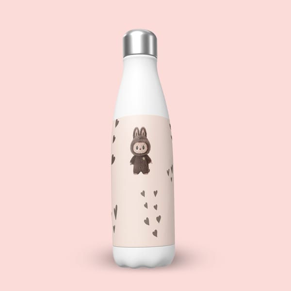 A white insulated water bottle with a light pink label showcasing a brown, bunny-eared character and a trail of dark brown hearts, positioned on a solid light pink background