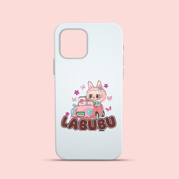 A close-up shot of a white smartphone case with a cartoon-style illustration of the character Labubu in a pink car, surrounded by butterflies and flowers, with the text 